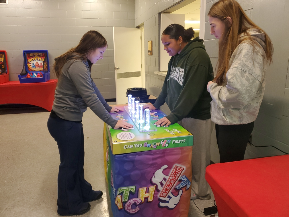 Students playing interactive games at a school field day event