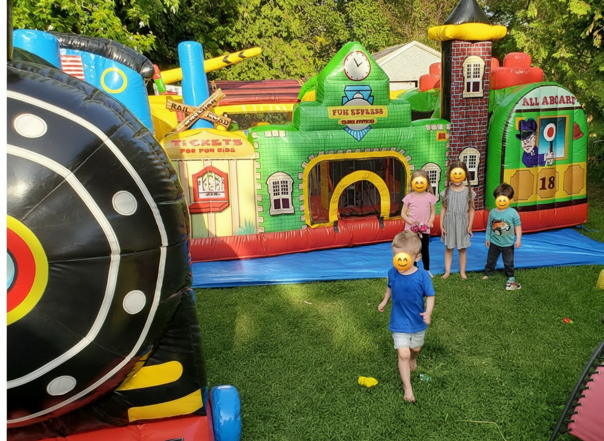 Children near colorful train station toddler inflatable